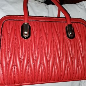 Red faux leather puse